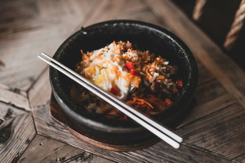 black ceramic bowl with chopsticks